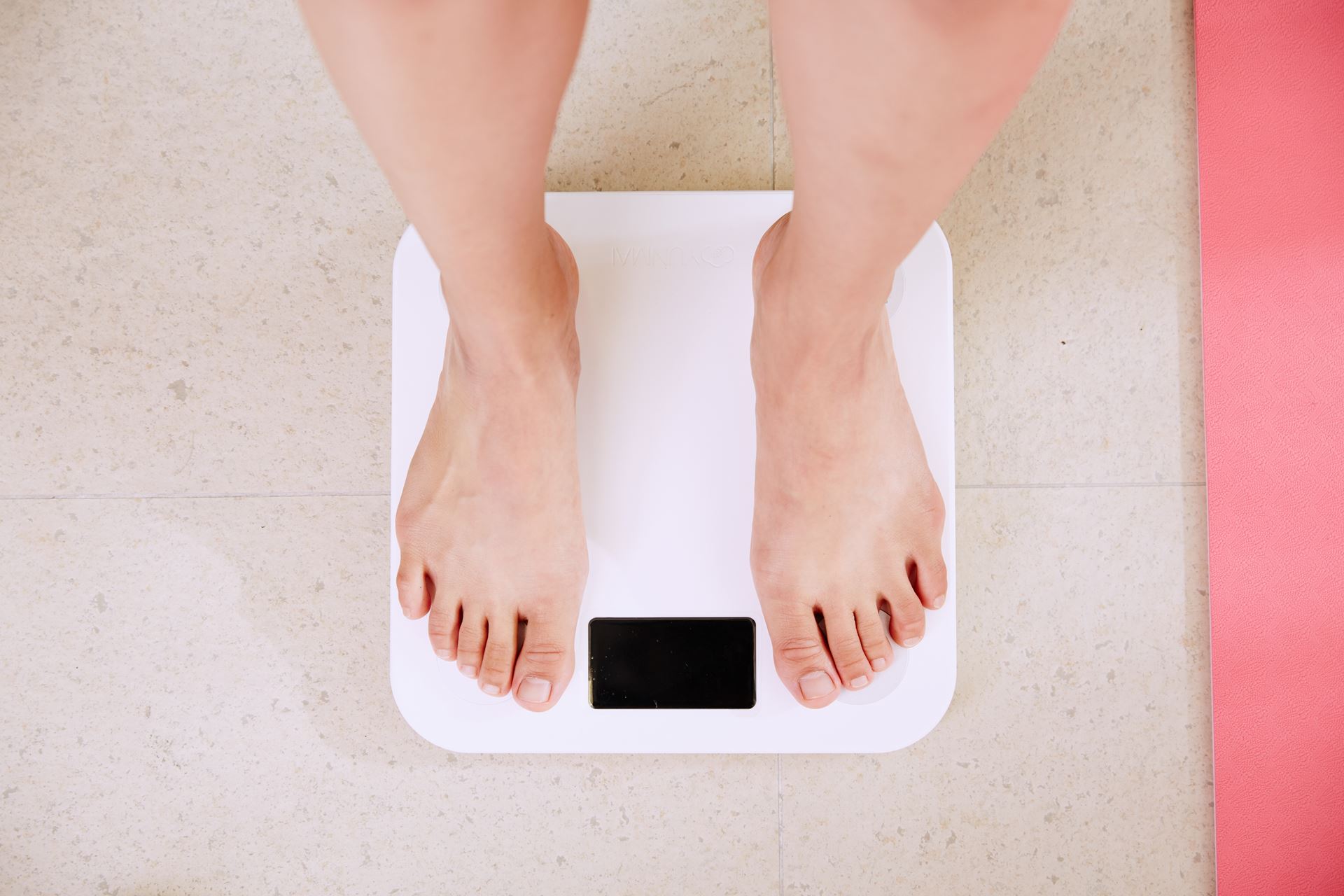 a woman looking at the scales